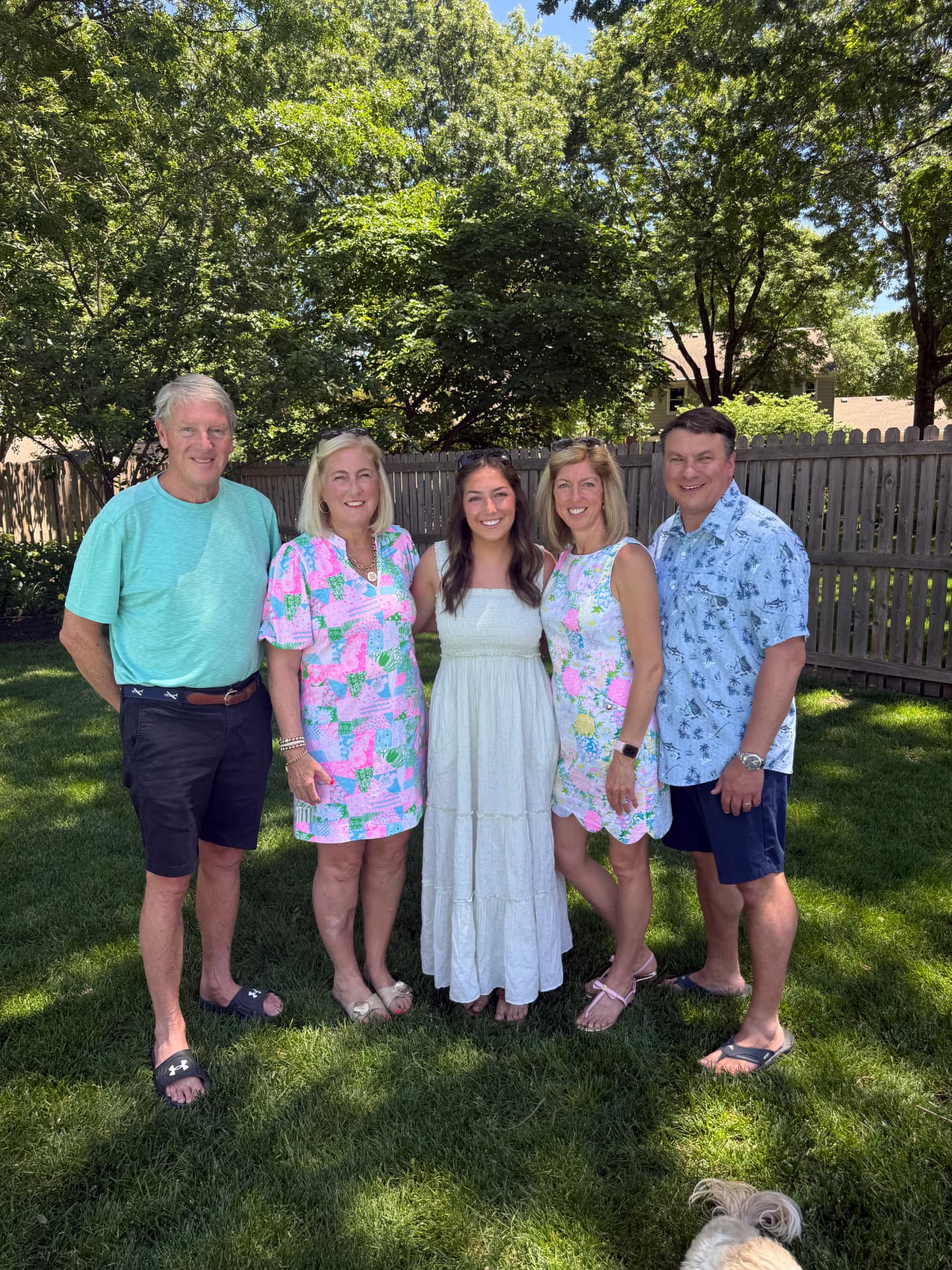 Annie Lawton with her family in a sunny backyard